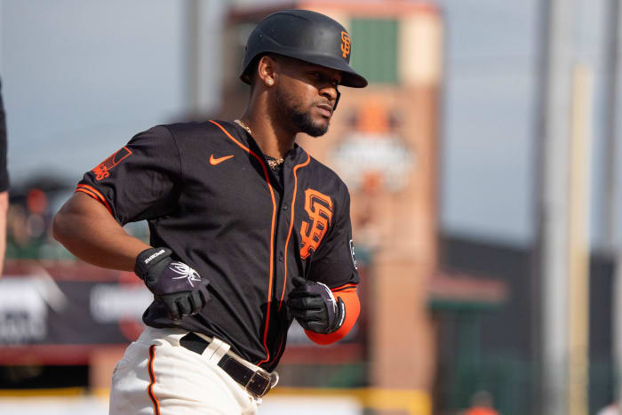 San Francisco Giants infielder Otto Lopez (54) rounds third after a home run in the ninth against the Chicago Cubs during a spring training game at Scottsdale Stadium.